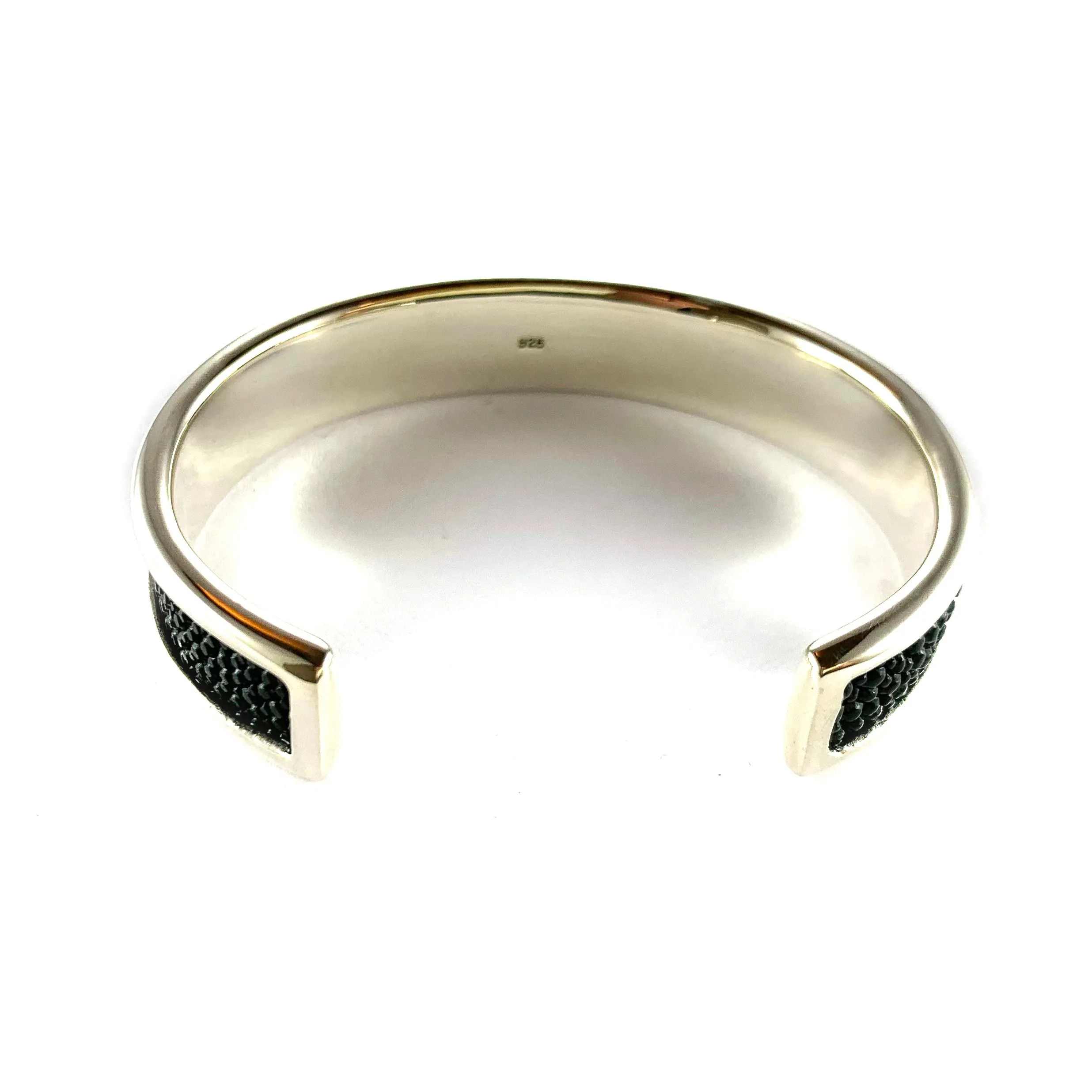 Cross silver bangle with devil fish leather