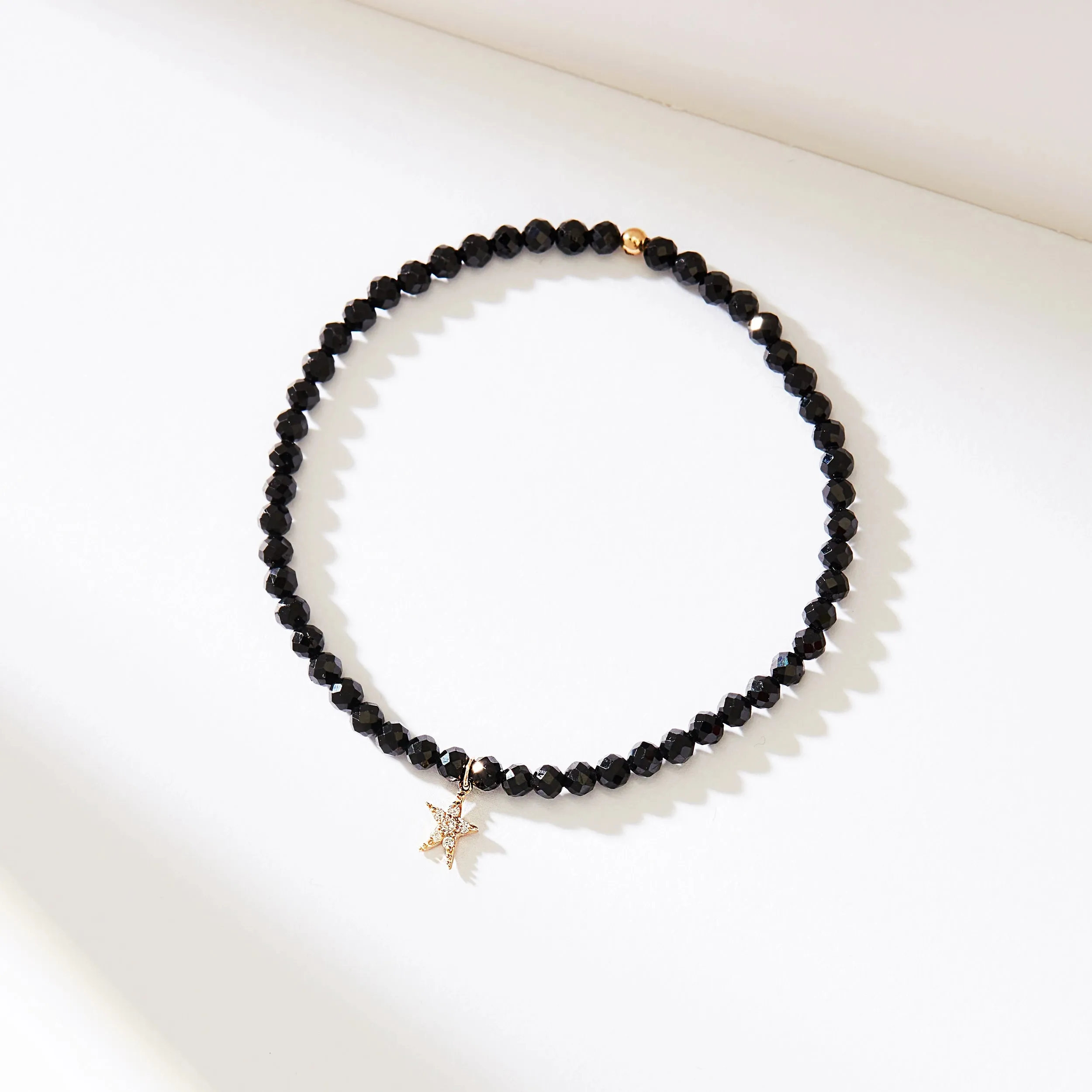 guidance bright star black spinel stretch bracelet - 14k yellow gold