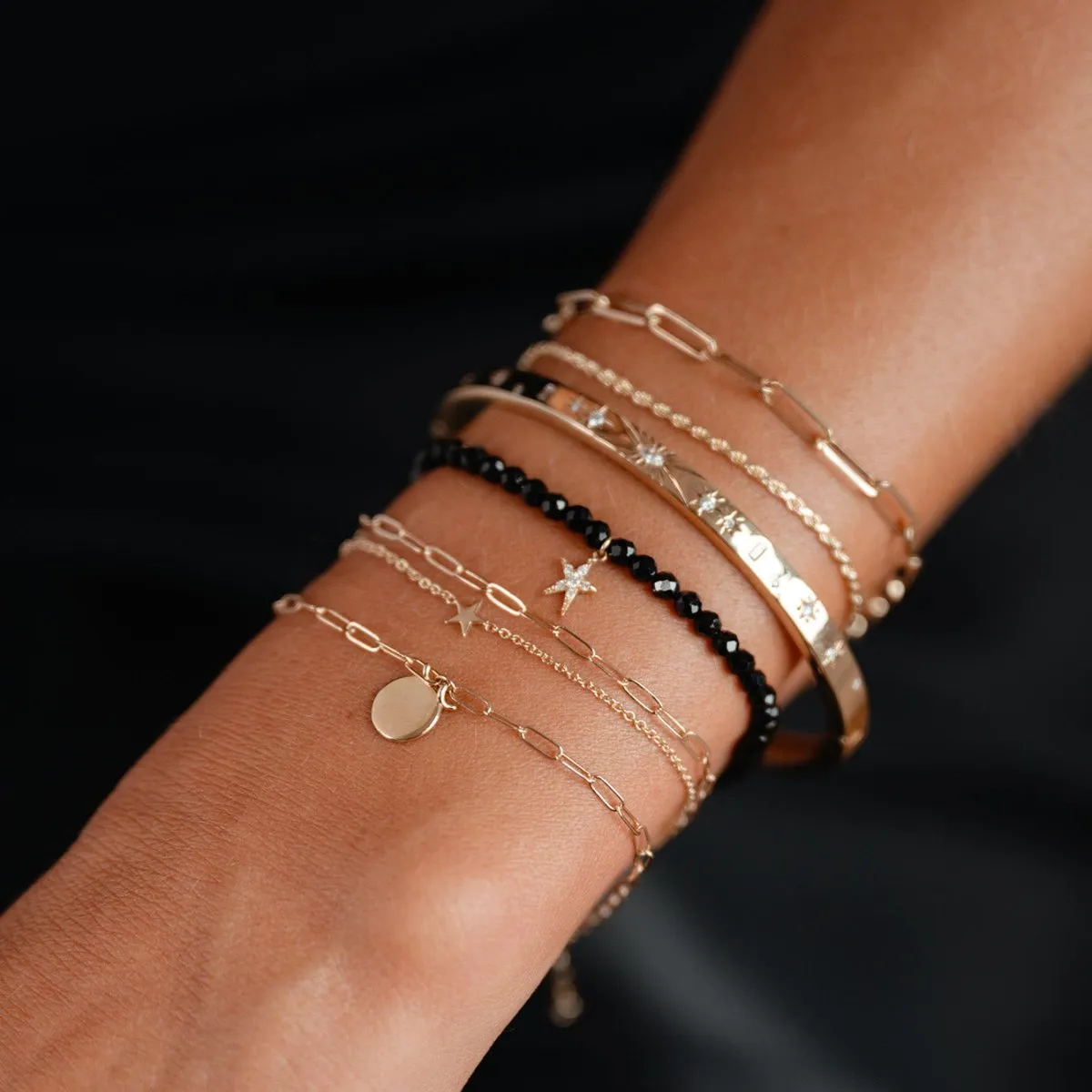 guidance bright star black spinel stretch bracelet - 14k yellow gold