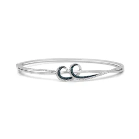 Jewelili Sterling Silver With 1/3 CTTW Treated Blue Diamond and Natural White Round Diamond Wavy Bangle